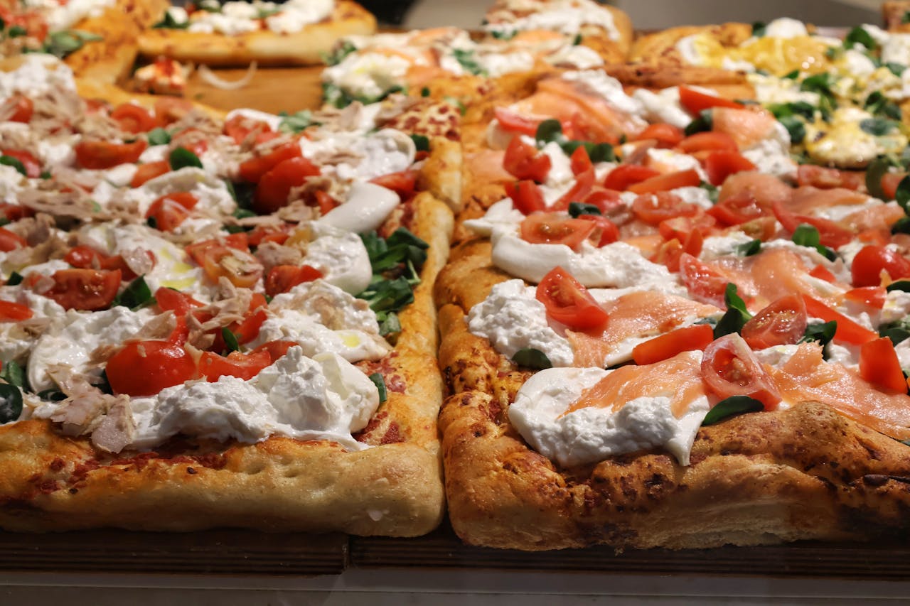 square pizza with cheese and tomato toppings
